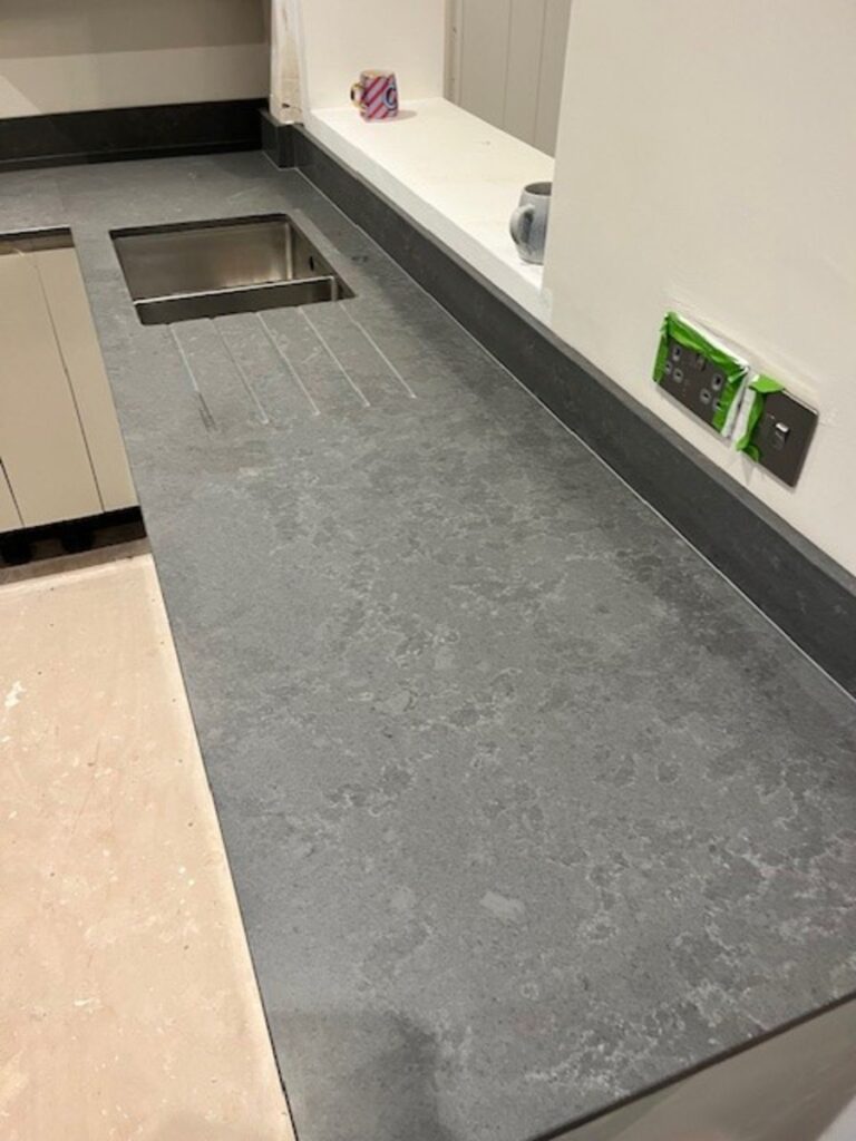 CRL Stella Gris quartz worktops with upstand and hob splash back installed in Leigh Wigan