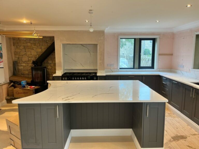 Large white veined Island with a curved edge for seating installed in Skipton Yorkshire in Cimstone Calacatta Venato