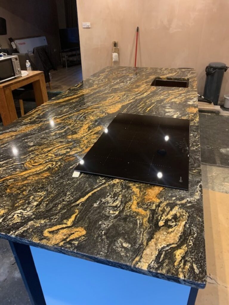 Granite with large gold veins running through installed in Astley Wigan
