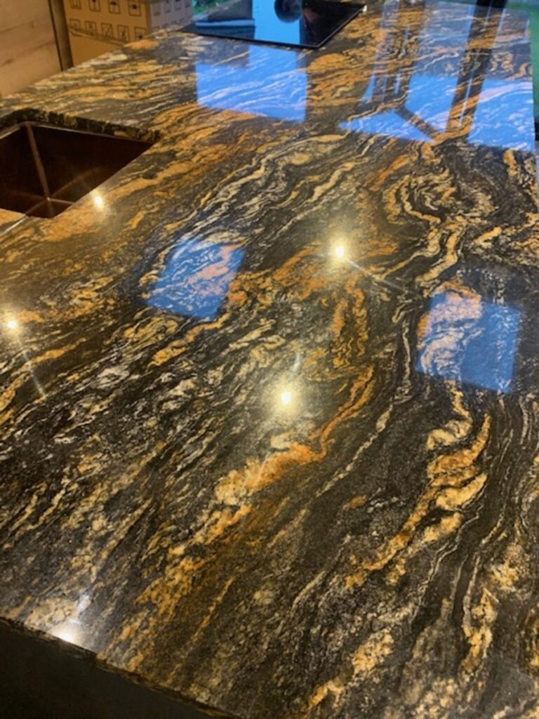 Gold veined black granite called Cosmic Gold installed in Wigan Astley