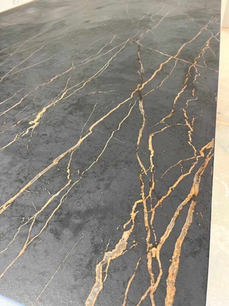 Dekton Laurent Black Ceramic colour with Gold veins running through installed in Sale Cheshire