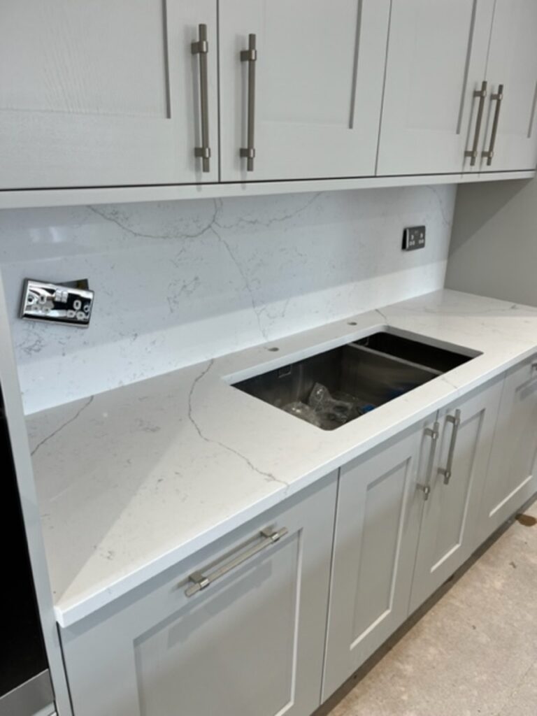 Fugen Avalanche countertop installed in Atherton Manchester with a wall splashback