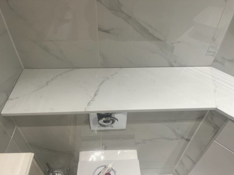 White with a thin grey line runnung through Fugen Avalanche Vanity top installed in Bowdon Altrincham