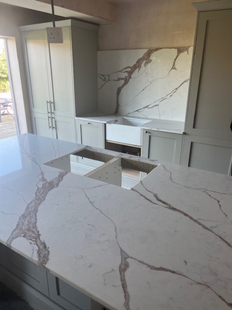 Nile Calacatta Oro Island with a striking vein running through the material installed in Presnton Wirral