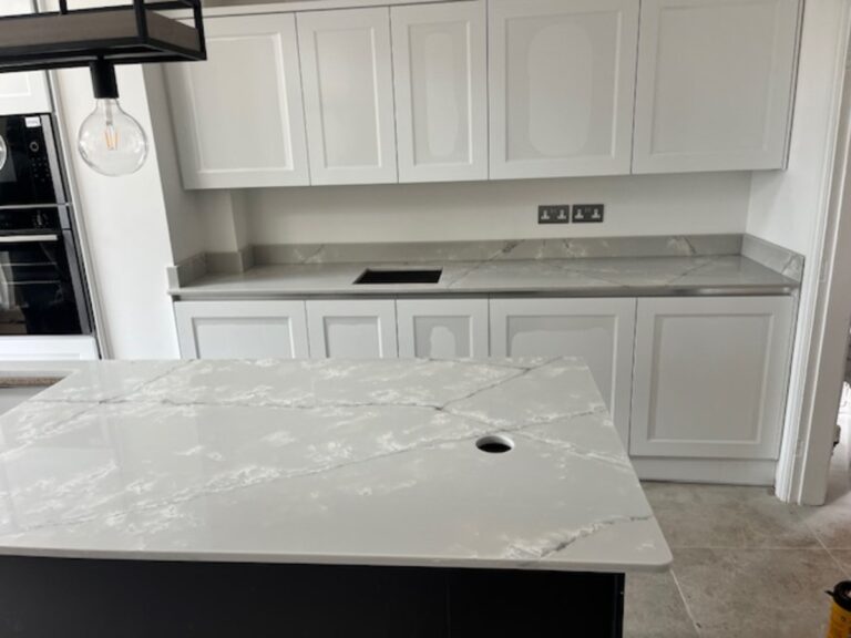 RT Ice White quartz worktops and island with a matching up stand installed in Westhoughton Bolton
