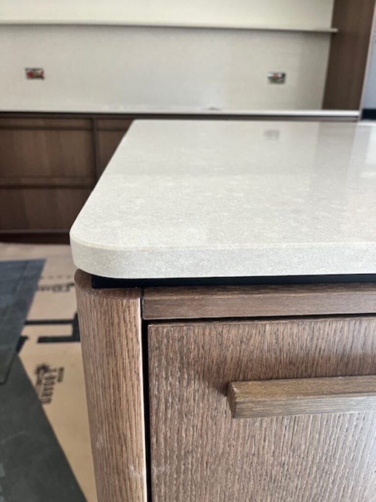 Kitchen Island with curved corners manufactured in Silkstone Oakham Ash and installed in Wilmslow Cheshire