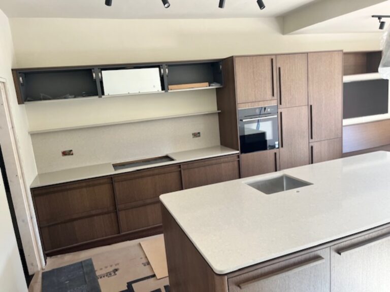 Silkstone Oakham Asg with a splashback and floating shelf installed in Wilmslow Cheshire